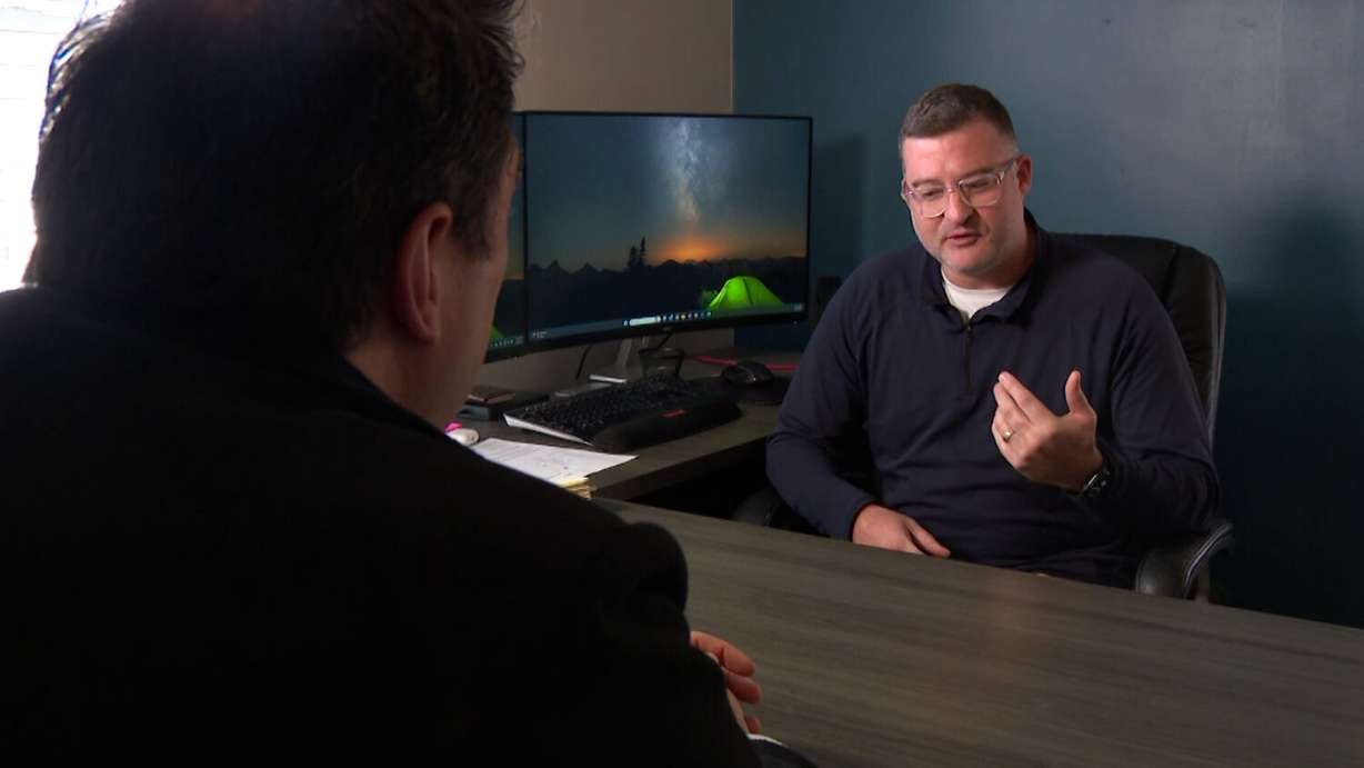 Attorney Britten Hepworth, right, explains to KSL's Matt Gephardt how a home security service contract can outlive the homeowner.