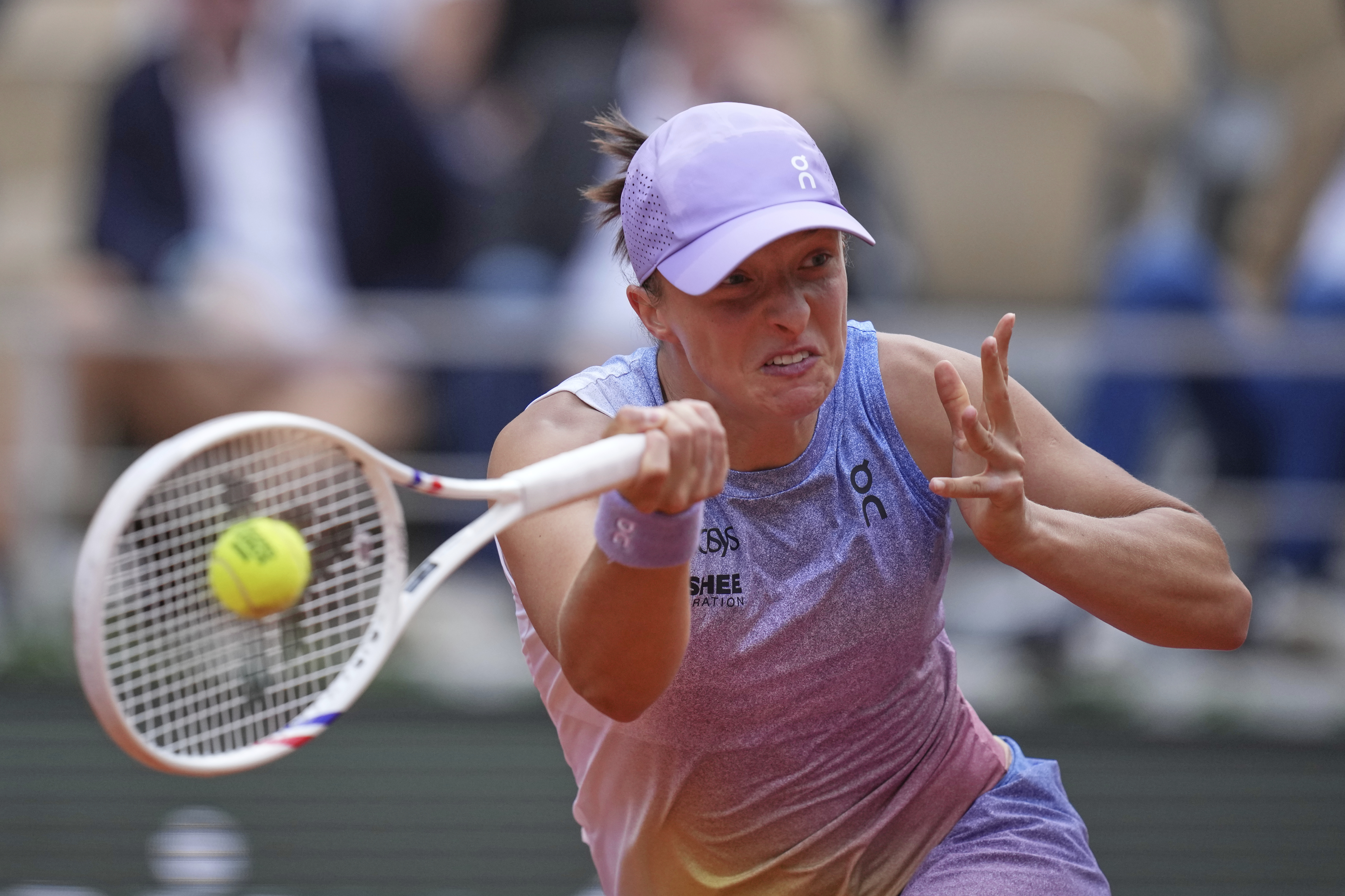 Poland's Iga Swiatek returns the ball to Britain's Emma Raducanu during their second round match of the French Tennis Open, at the Roland-Garros stadium, in Paris, Wednesday, May 28, 2025.