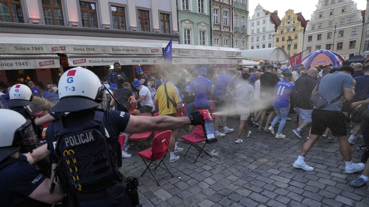 Police spray tear gas at Chelsea fans ahead of the Europa Conference League final soccer match between Real Betis and Chelsea in Wroclaw, Poland, Tuesday, May 27, 2025.