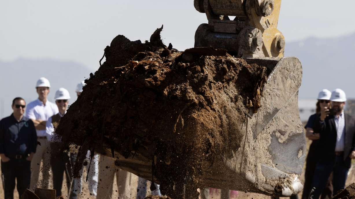Utah Inland Port Authority holds a symbolic “first scoop” to mark the official start of remediation activities at the North Temple Landfill site in Salt Lake City on Wednesday.