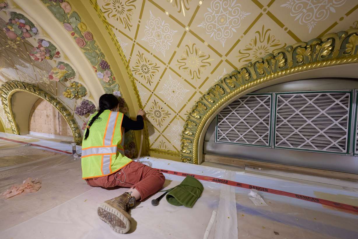 Crews do the restoration work on the intricate ceiling of the celestial room in the Salt Lake Temple on May 7.