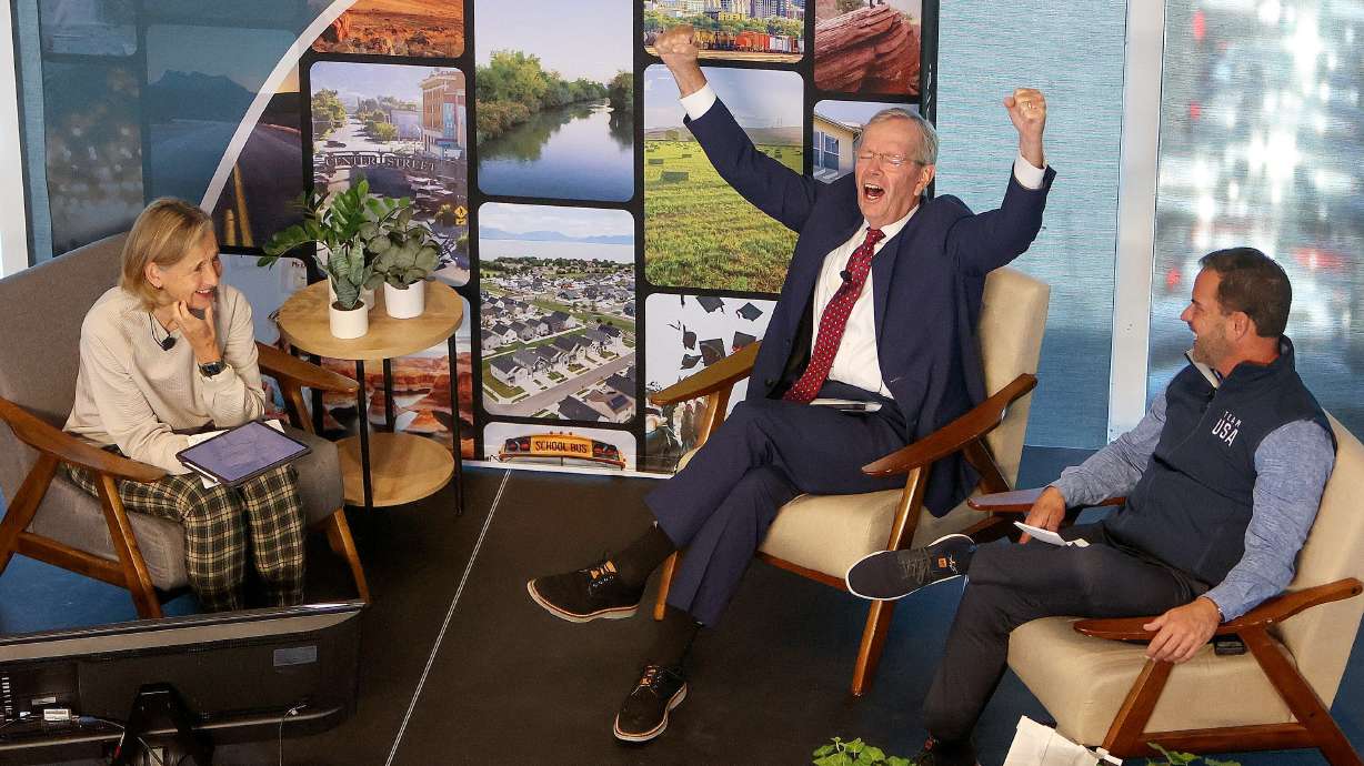 Former Gov. Mike Leavitt and Brad Wilson, Salt Lake City-Utah 2034 Olympic and Paralympic Games CEO, discuss the 2034 Olympic and Paralympic Games, moderated by Natalie Gochnour, Kim C. Gardener Policy Institute director and Envision Utah board of directors vice chair, left, at the Rice-Eccles Stadium in Salt Lake City on Wednesday.