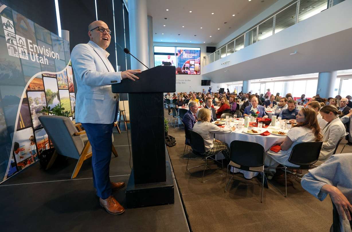 Jason Brown, Envision Utah interim CEO, gives welcome remarks at the Spring Breakfast with Envision Utah at the Rice-Eccles Stadium in Salt Lake City on Wednesday.