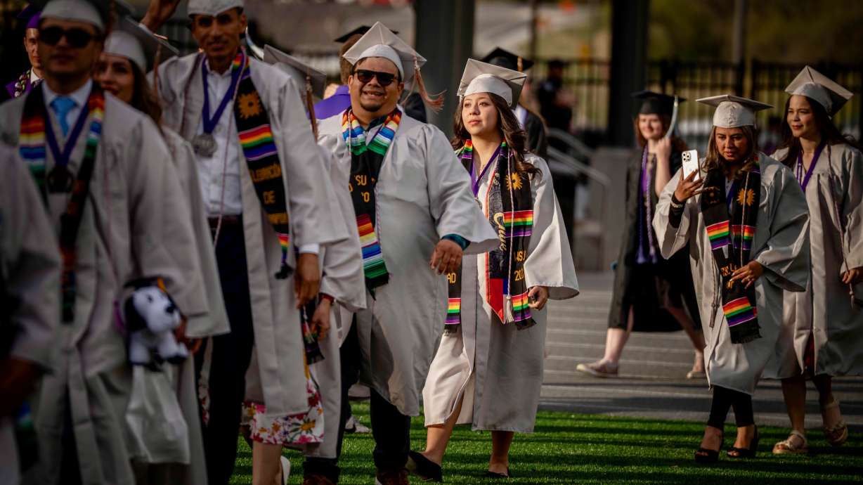Many of the Weber State students in line to secure entrepreneurship certificates in the Ogden school's new Building Puentes program took part in commencement exercises on April 25.