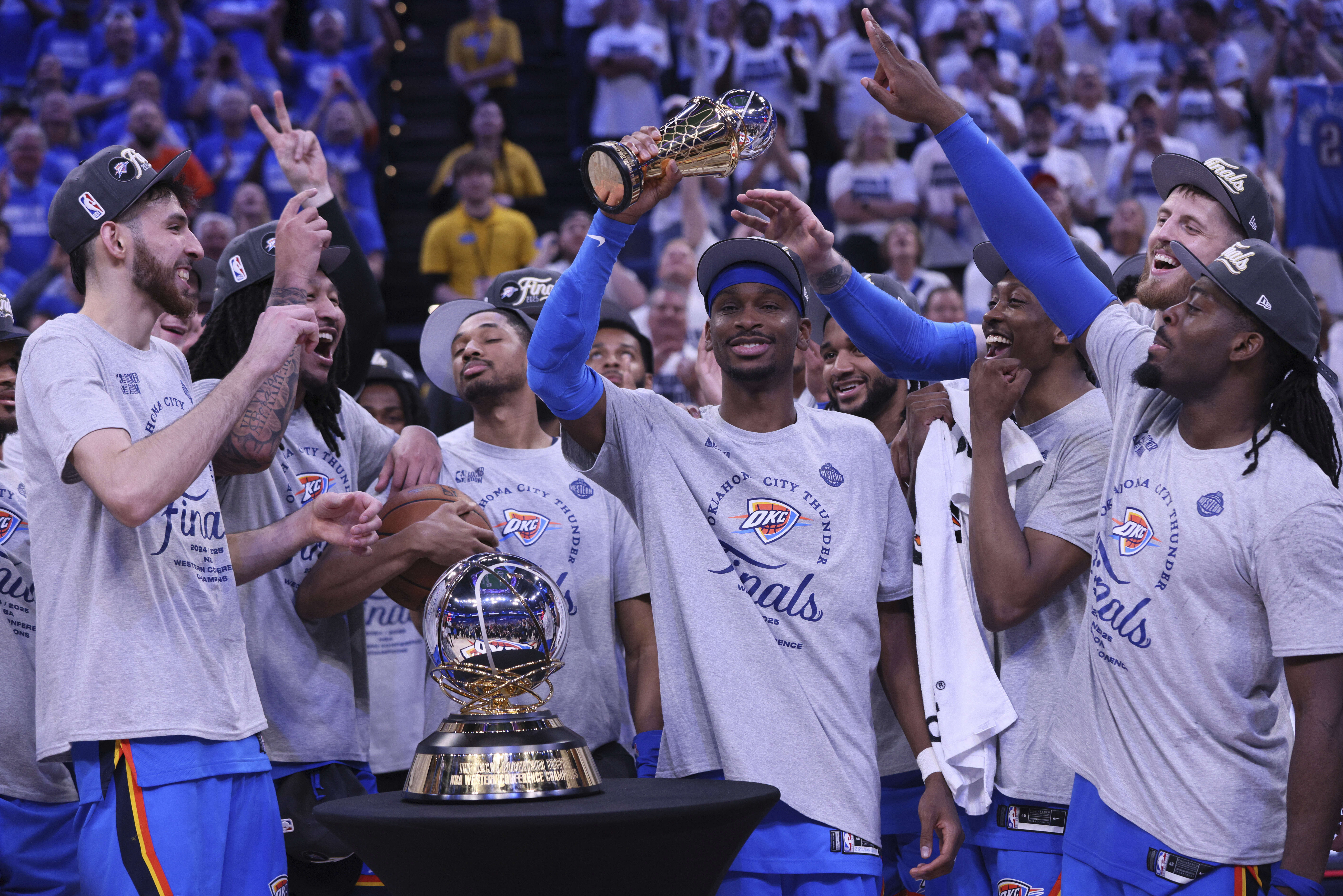 Oklahoma City Thunder guard Shai Gilgeous-Alexander (2), middle, celebrates with teammates after Game 5 of the Western Conference finals of the NBA basketball playoffs against the Minnesota Timberwolves, Wednesday, May 28, 2025, in Oklahoma City. 