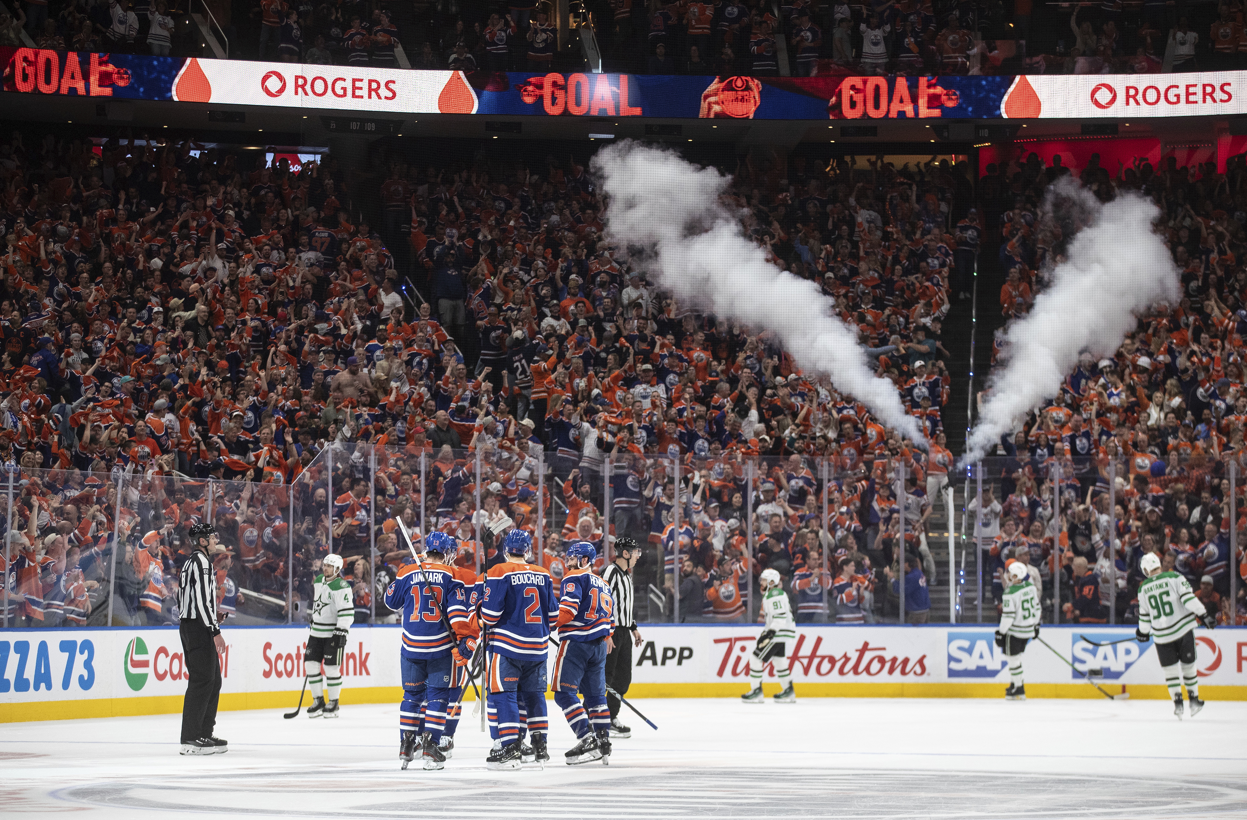 Edmonton Oilers players celebrate a goal against the Dallas Stars during the third period in Game 4 of the Western Conference finals in the NHL hockey Stanley Cup playoffs in Edmonton, Alberta, Tuesday, May 27, 2025. 