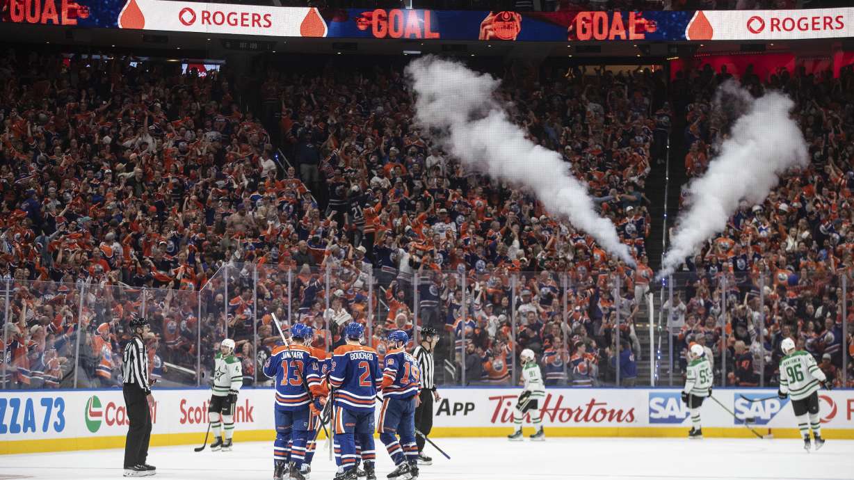 Edmonton Oilers players celebrate a goal against the Dallas Stars during the third period in Game 4 of the Western Conference finals in the NHL hockey Stanley Cup playoffs in Edmonton, Alberta, Tuesday, May 27, 2025.