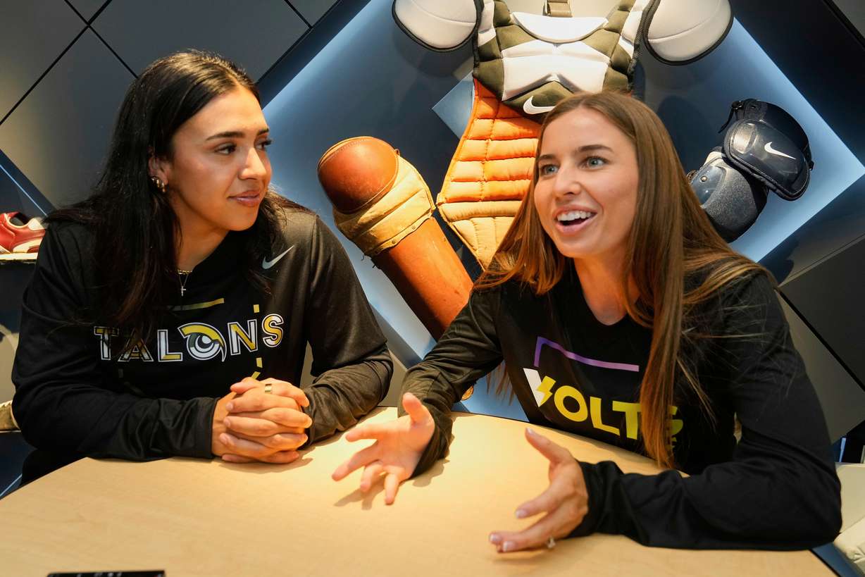Athletes Unlimited Softball League players Charlie Palacios, left, of the Talons, and Sis Bates of the Bolts, are interviewed at Major League Baseball's headquarters in New York, Thursday, May 29, 2025.