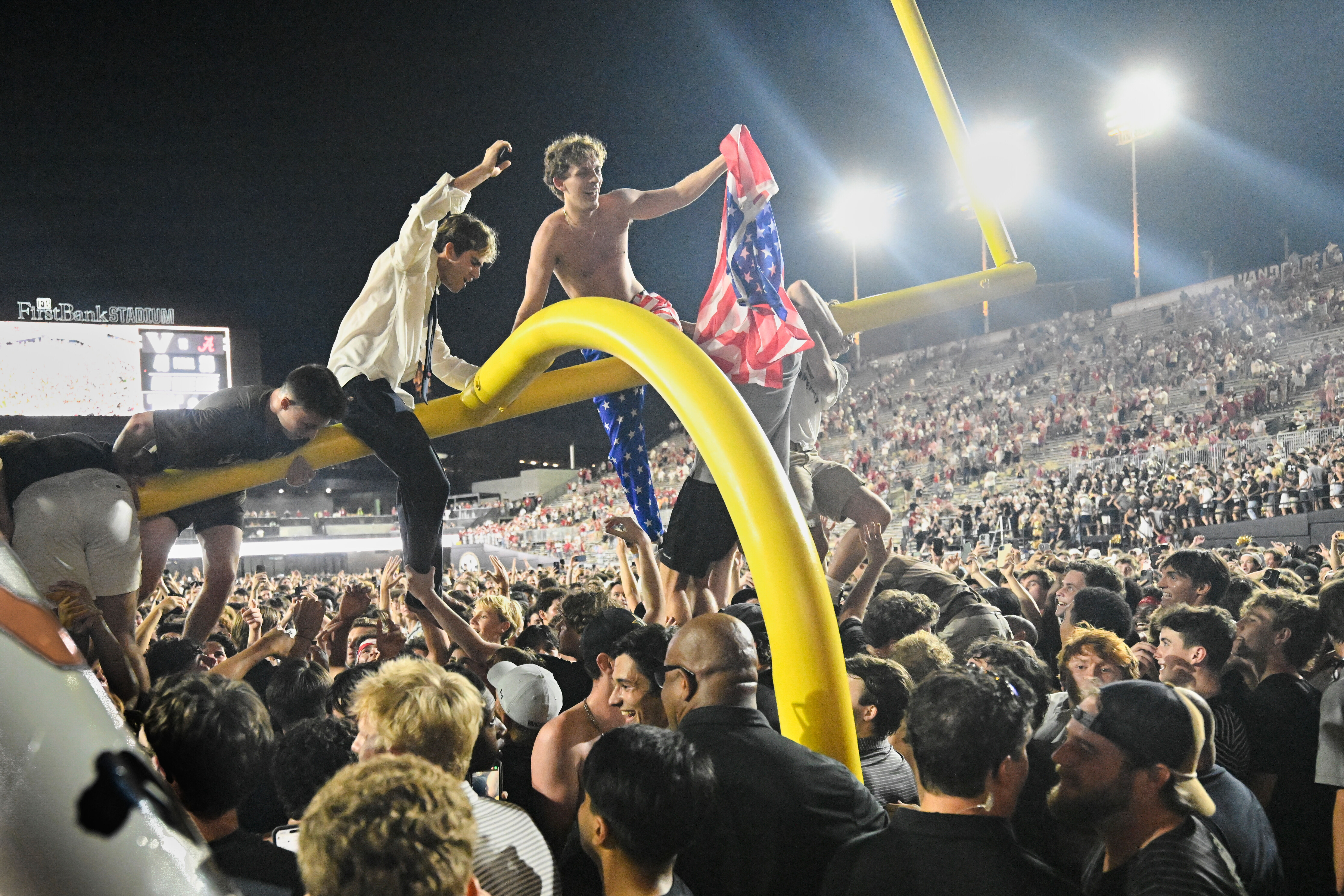 FILE - Vanderbilt fans climb a goalpost as they celebrate on the field after defeating Alabama in an NCAA football game, Saturday, Oct. 5, 2024, in Nashville, Tenn. 