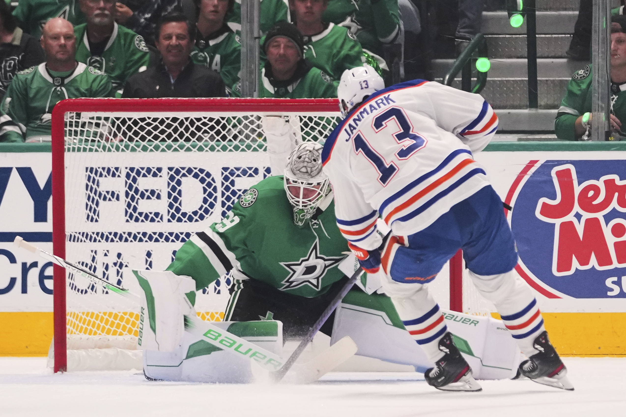 Edmonton Oilers center Mattias Janmark (13) scores against Dallas Stars goaltender Jake Oettinger (29) during the first period of Game 5 of the Western Conference finals in the NHL hockey Stanley Cup playoffs, Thursday, May 29, 2025, in Dallas. 