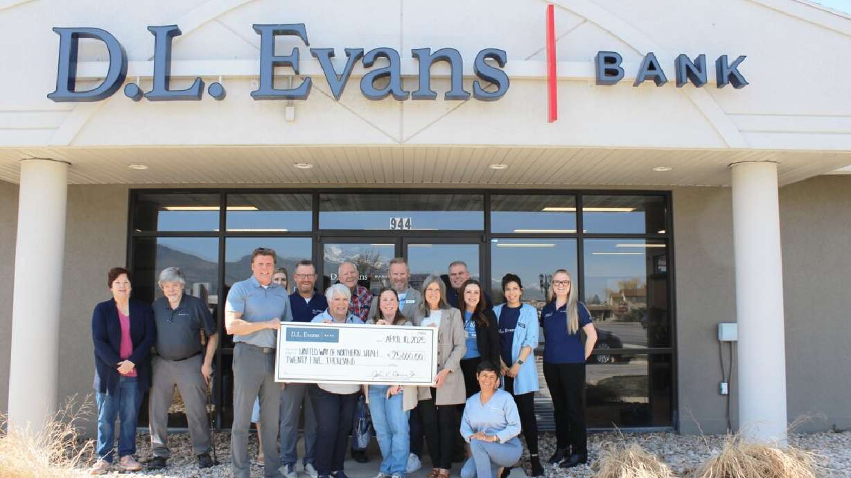 Staff at D.L. Evans Bank in Idaho pose with a check for the United Way of Northern Utah. The donation is $25,000.