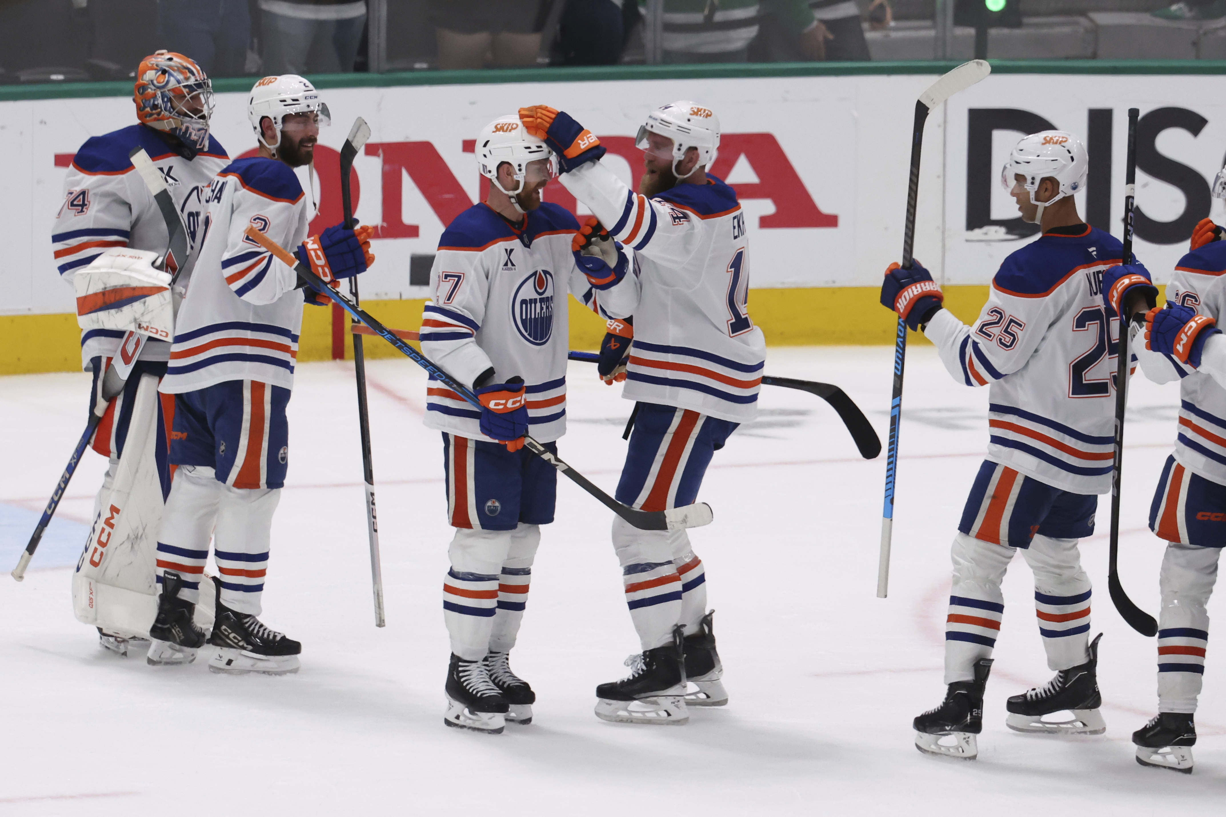 Edmonton Oilers players celebrate after winning Game 5 of the Western Conference finals in the NHL hockey Stanley Cup playoffs against the Dallas Stars, Thursday, May 29, 2025, in Dallas. 