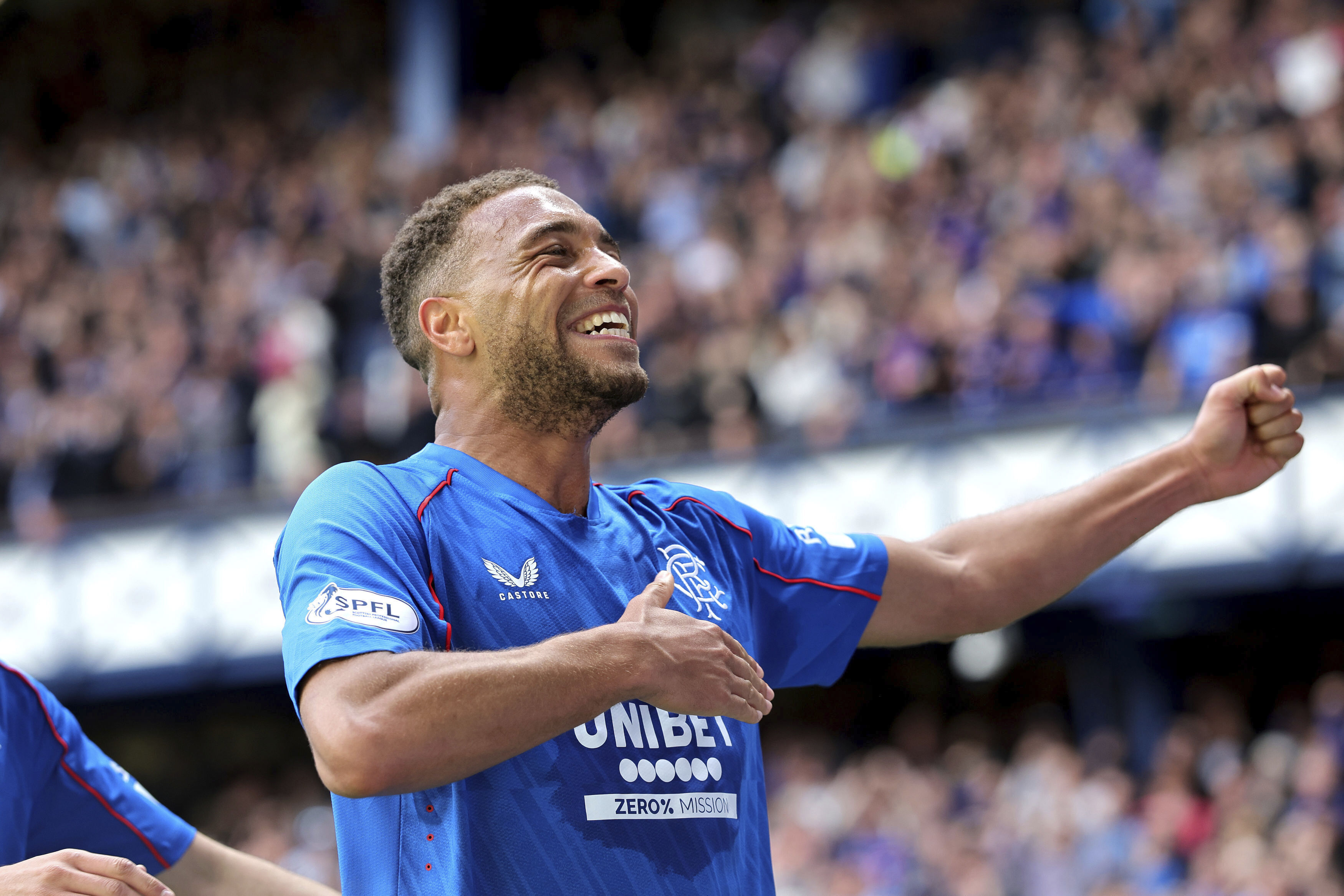 Rangers' Cyriel Dessers celebrates scoring their side's first goal of the game during the Scottish Premiership soccer match between Rangers and Celtic at Ibrox Stadium, Glasgow, Scotland, Sunday, May 4, 2025. 
