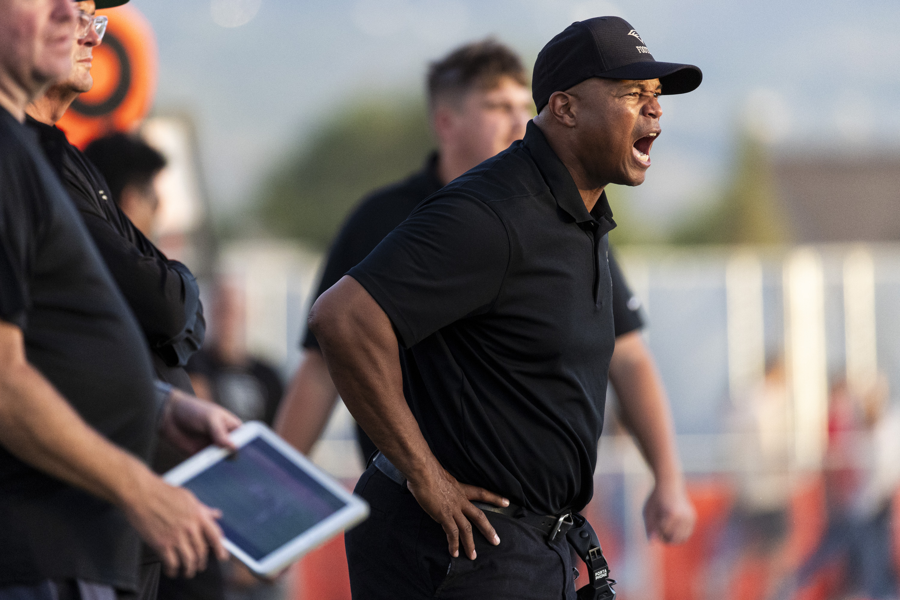 Maple Mountain head coach Kalin Hall calls out to his players during a game against Spanish Fork held at Spanish Fork High School in Spanish Fork on Aug. 23, 2024.