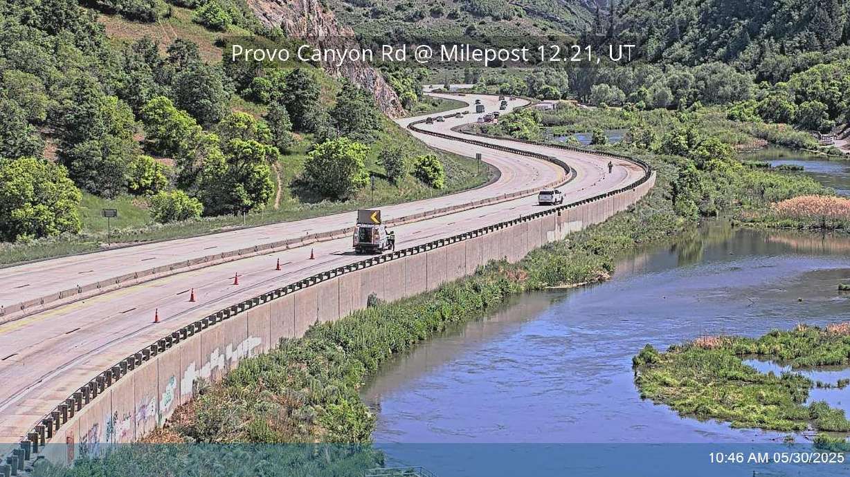 Troopers close off the right lane and shoulder of eastbound U.S. 189 in Provo Canyon after a cyclist was struck by a truck pulling a trailer on Friday.