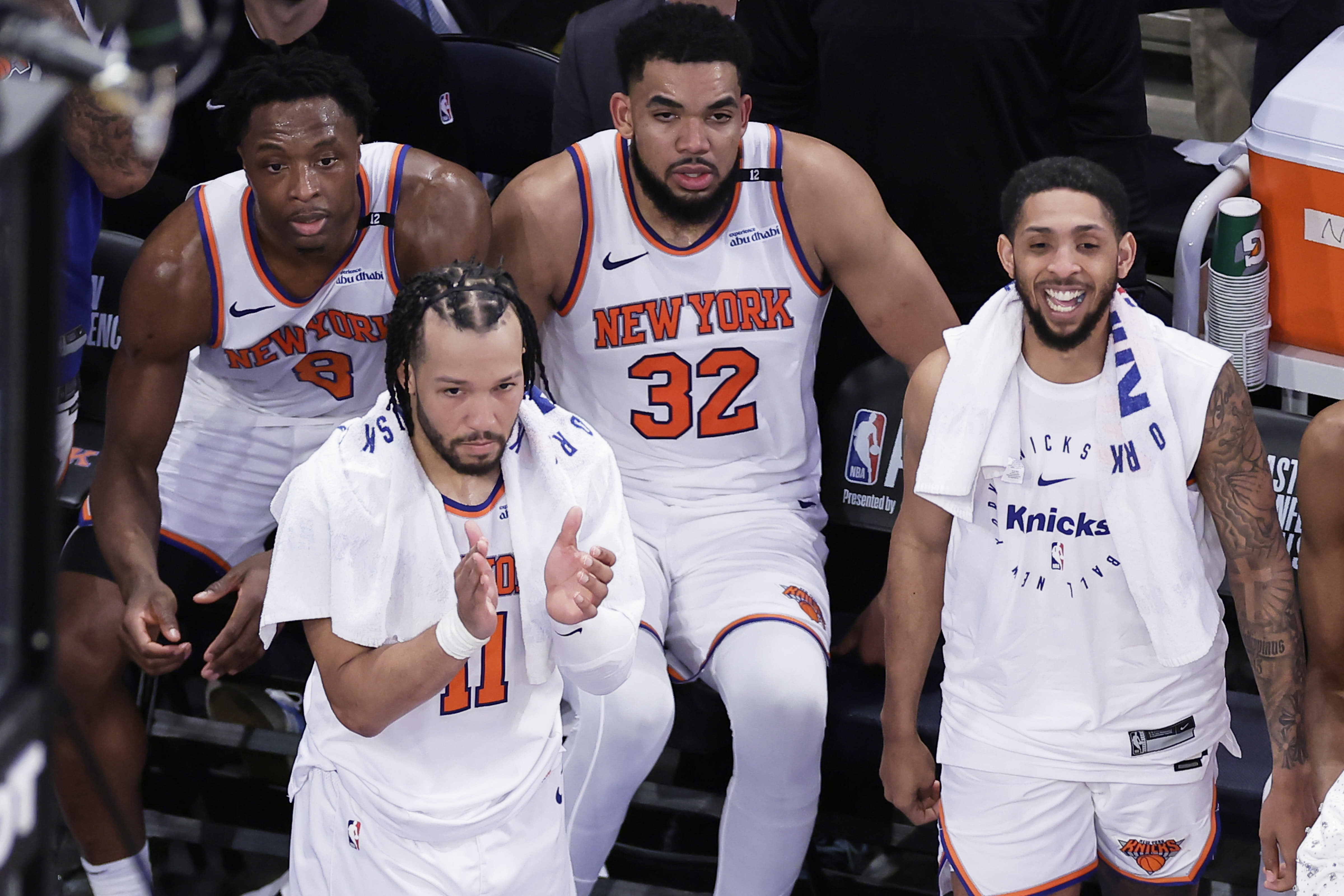 New York Knicks guard Jalen Brunson (11), forward OG Anunoby (8), center Karl-Anthony Towns (32) and guard Cameron Payne (1) react during the fourth quarter of Game 5 of the NBA basketball Eastern Conference finals against the Indiana Pacers, Thursday, May 29, 2025, in New York. 