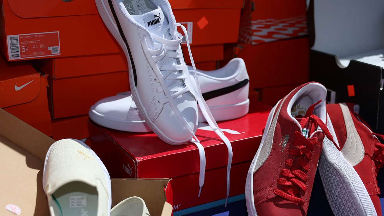 New shoes that will be available for Murray City School District students are displayed at the Intermountain Medical Center in Murray on Friday. Intermountain staff earned a pair of shoes to donate to a student for every 50 miles walked.