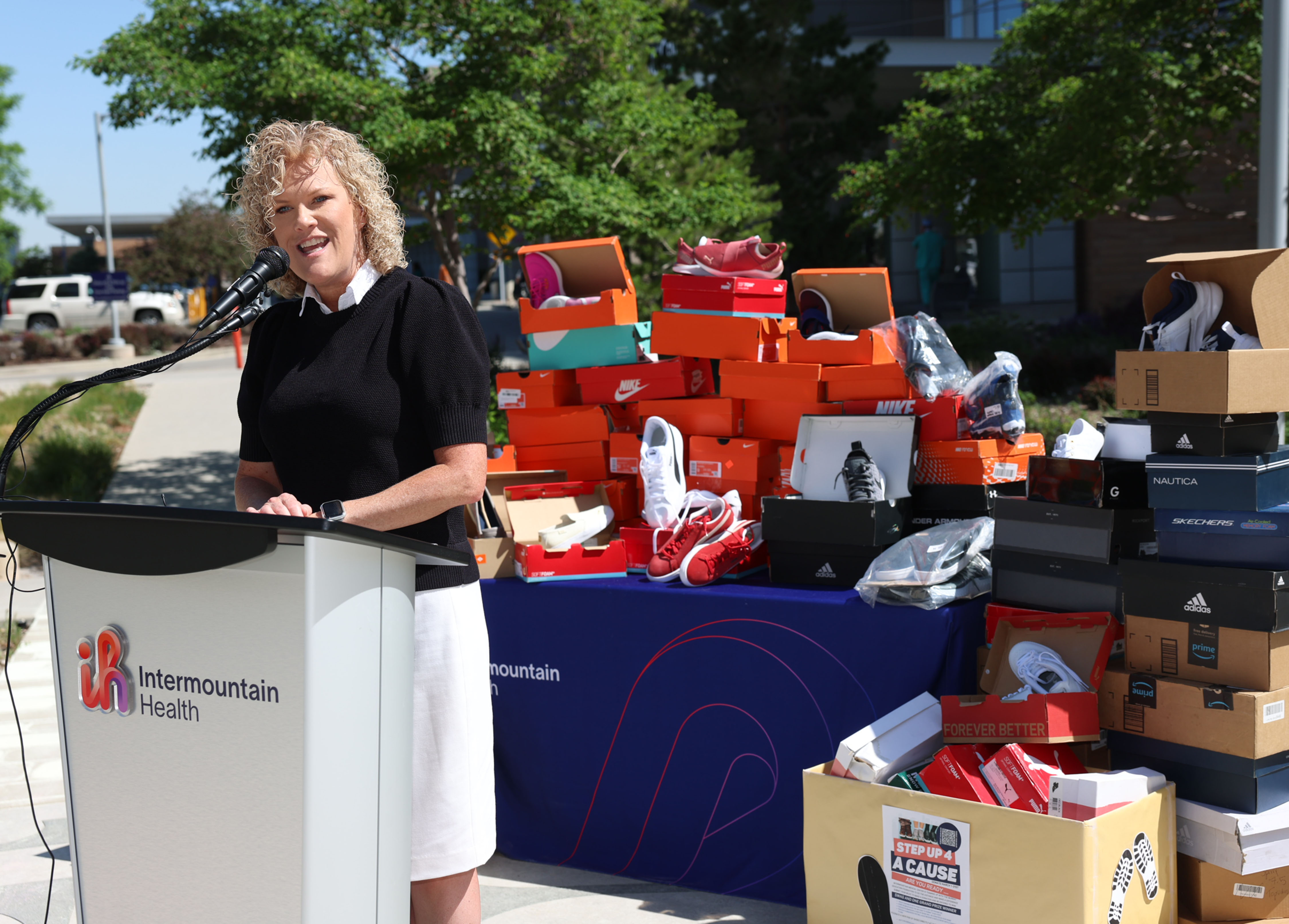 Jennifer Covington, superintendent of Murray City School District, speaks about the 475 pairs of new shoes that will be available for students at the Intermountain Medical Center in Murray on Friday.