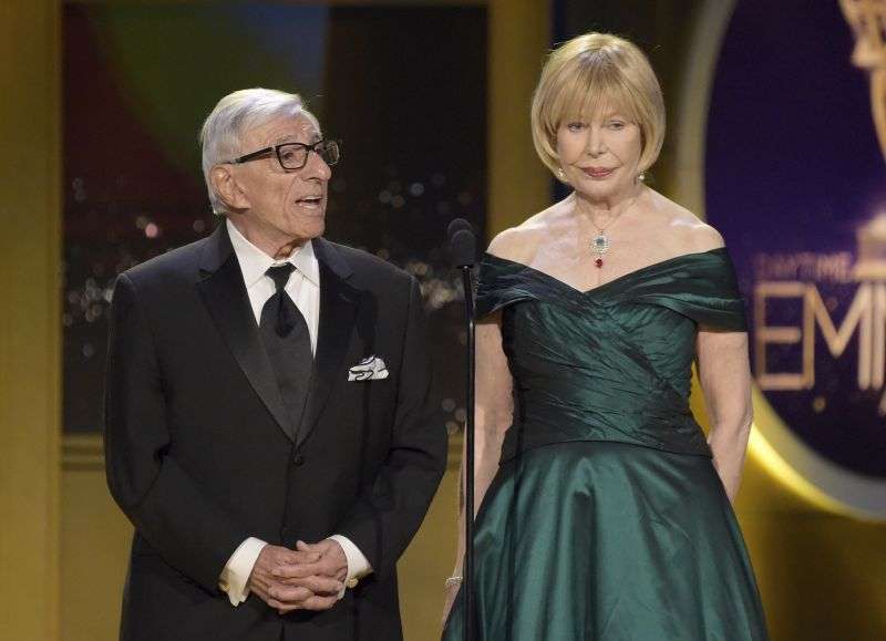 Jamie Farr, left, and Loretta Swit present a tribute to "Mr. Rogers" at the 45th annual Daytime Emmy Awards on April 29, 2018, in Pasadena, Calif.