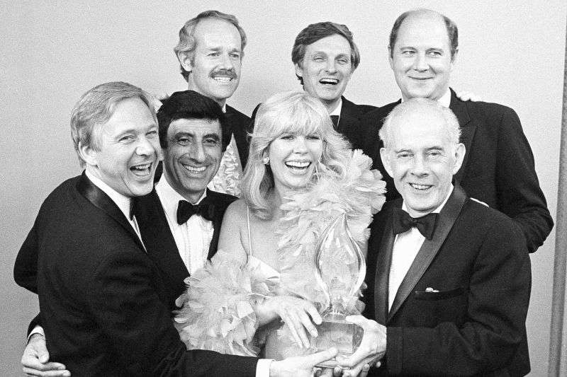 Cast members from "M-A-S-H," foreground from left, William Christopher, Jamie Farr, Loretta Swit and Henry Morgan, back row from left, Mike Farrell, Alan Alda and William Ogden Stiers, pose with their People's Choice Award for best comedy series in Santa Monica, Calif., on March 19, 1982.
