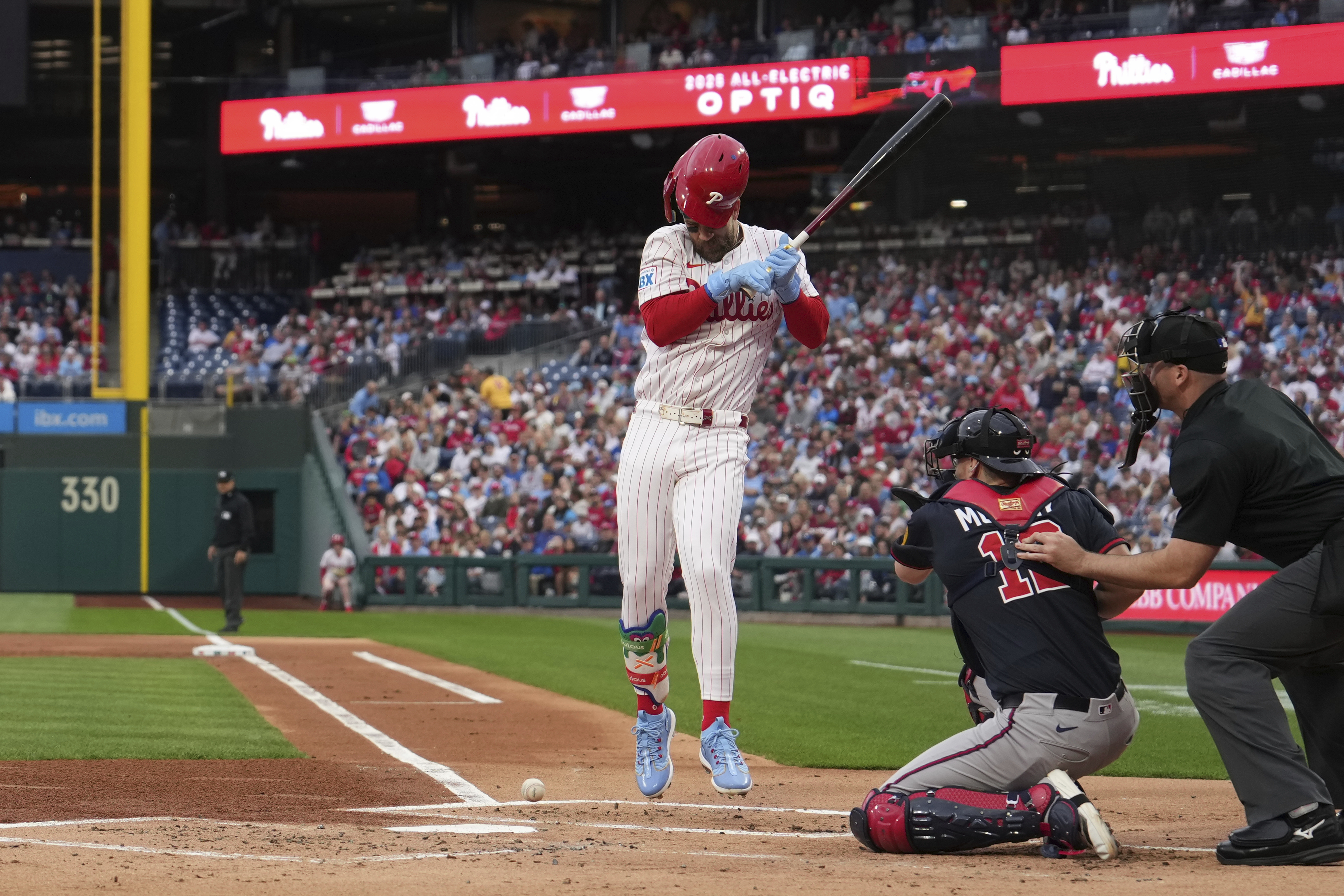 FILE - Philadelphia Phillies' Bryce Harper is hit by a pitch Atlanta Braves' Spencer Strider during a baseball game, Tuesday, May 27, 2025, in Philadelphia.