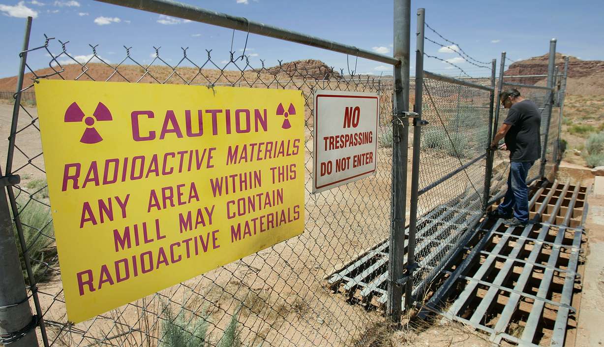 U.S. Energy Corp. resident project manager Daryl Winters locks the gate, on July 12, 2006, at the Shootaring Mill north of Ticaboo.