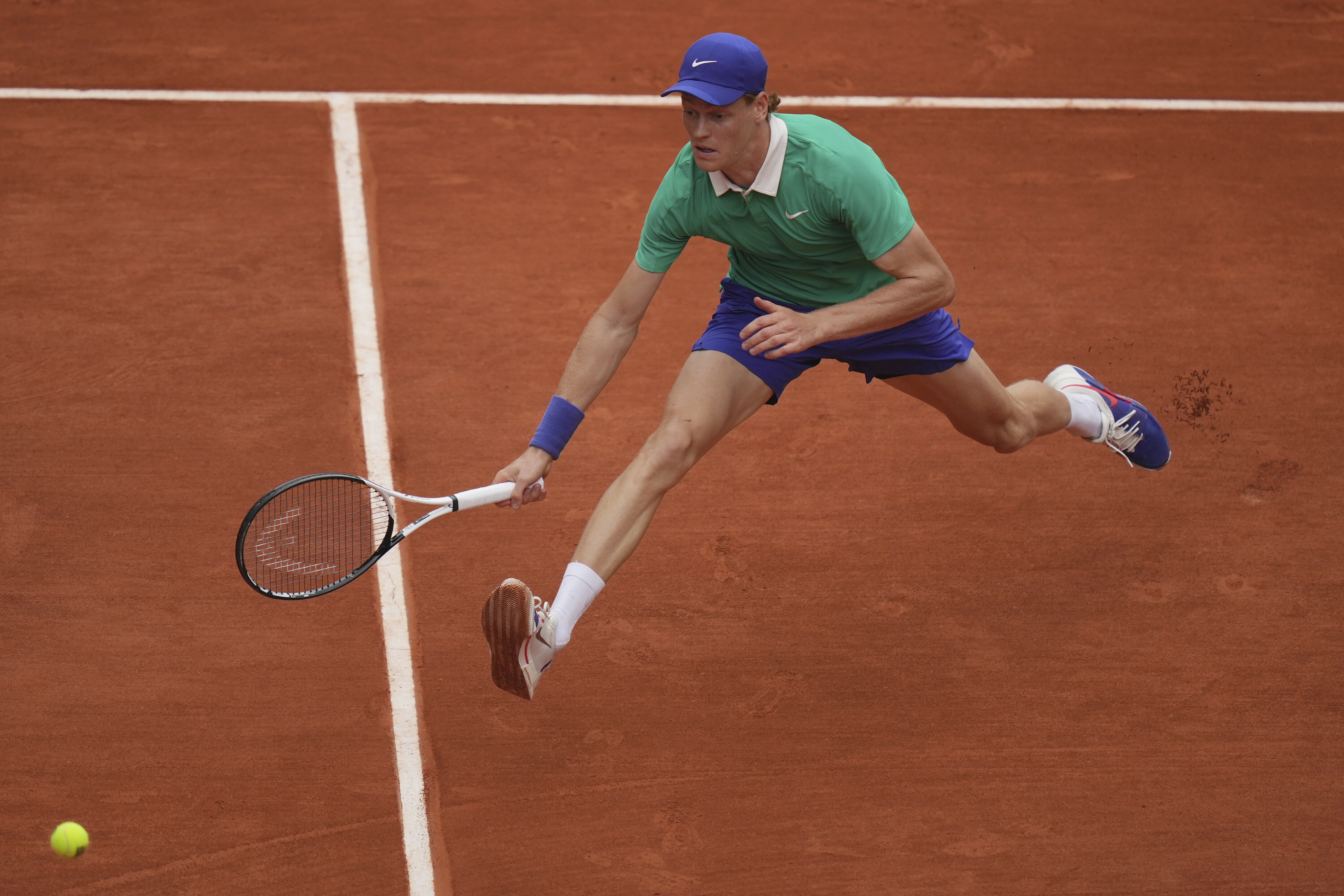 Italy's Jannik Sinner reaches for the ball as she plays Jiri Lehecka of the Czech Republic during their third round match of the French Tennis Open, at the Roland-Garros stadium, in Paris, Saturday, May 31, 2025. 