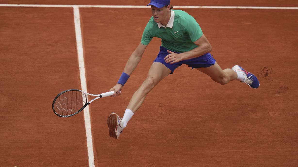 Italy's Jannik Sinner reaches for the ball as she plays Jiri Lehecka of the Czech Republic during their third round match of the French Tennis Open, at the Roland-Garros stadium, in Paris, Saturday, May 31, 2025.