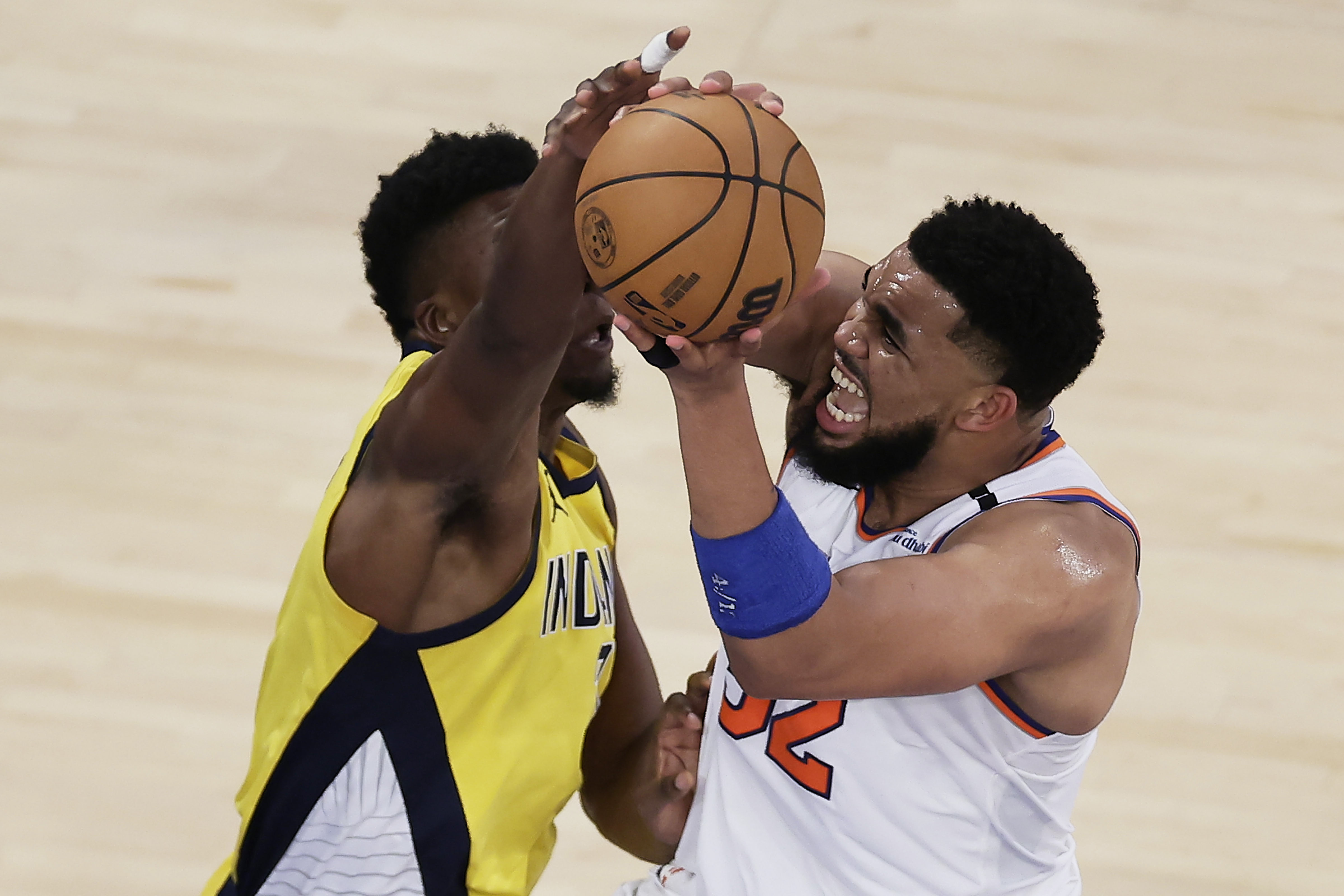 New York Knicks center Karl-Anthony Towns (32) puts up a shot against Indiana Pacers center Thomas Bryant (3) during the third quarter of Game 5 of the NBA basketball Eastern Conference finals, Thursday, May 29, 2025, in New York. 