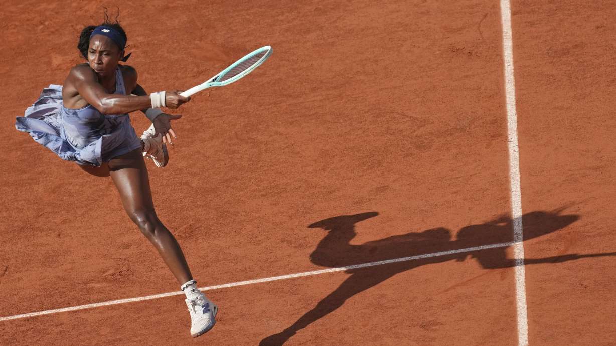 Coco Gauff of the U.S. returns the ball to Marie Bouzkova of the Czech Republic during their third round match of the French Tennis Open, at the Roland-Garros stadium, in Paris, Saturday, May 31, 2025.