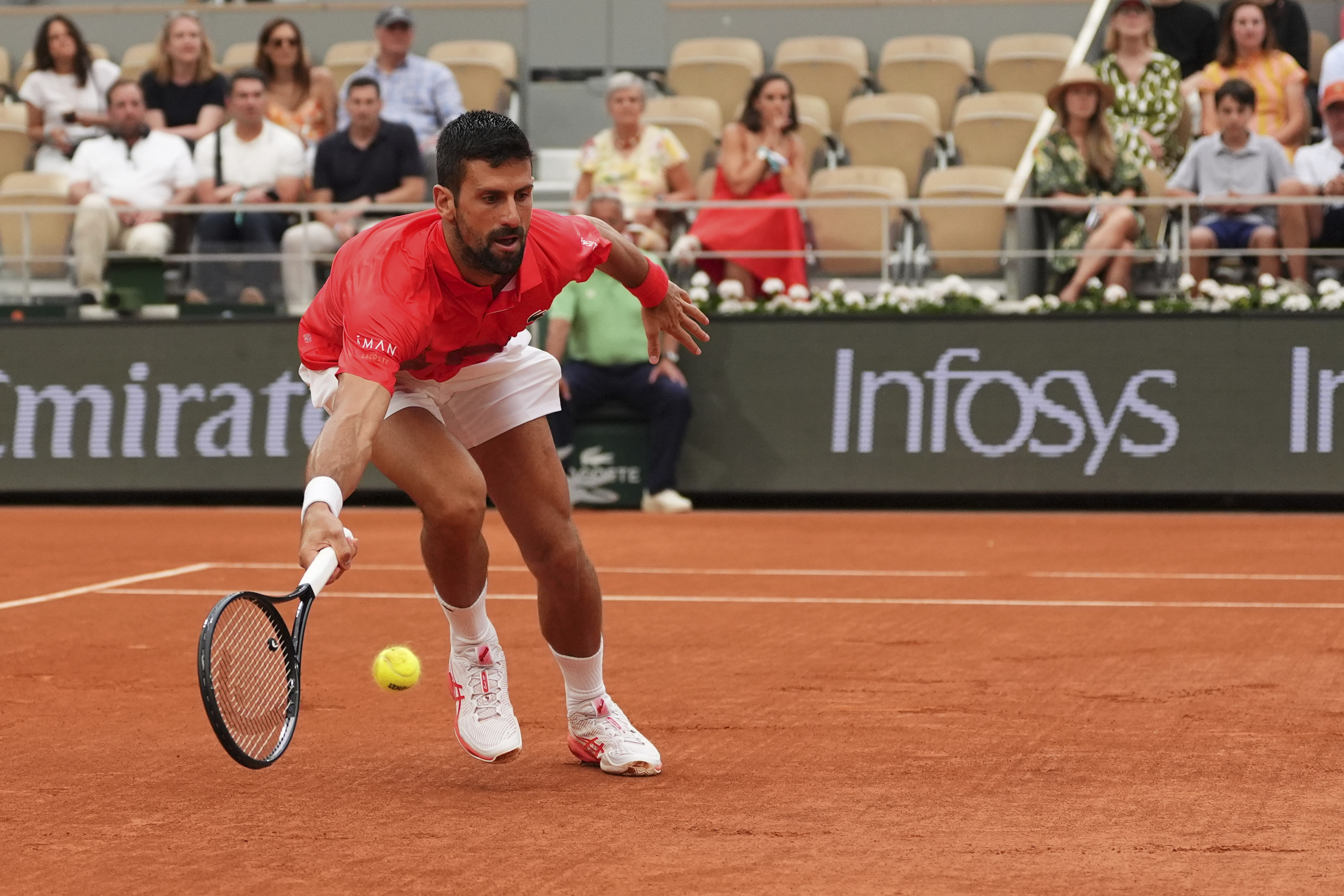 Serbia's Novak Djokovic returns the ball to Austria's Filip Misolic during their third round match of the French Tennis Open, at the Roland-Garros stadium, in Paris, Saturday, May 31, 2025. 