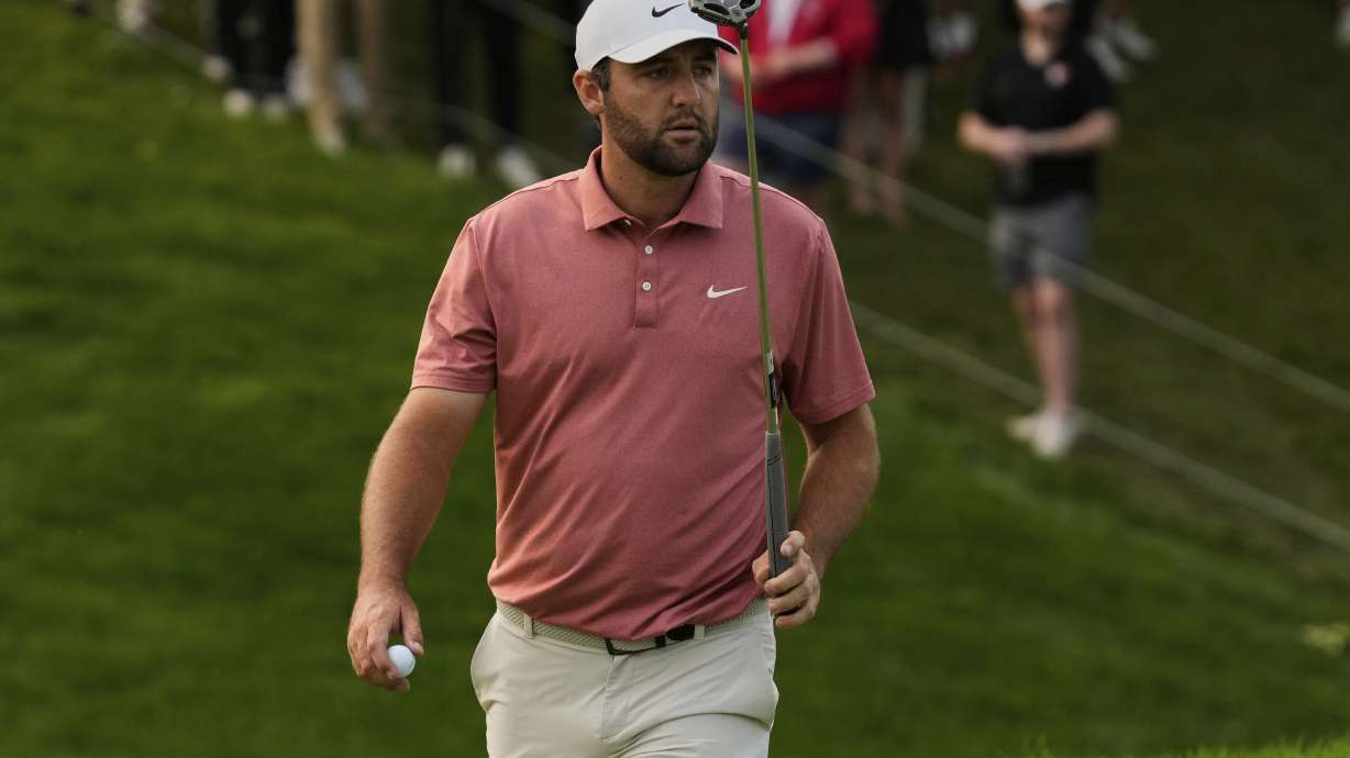 Scottie Scheffler gestures after his putt on the 18th green during the third round of the Memorial golf tournament Saturday, May 31, 2025, in Dublin, Ohio.