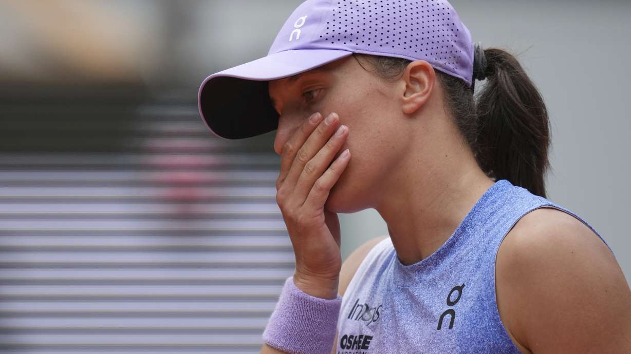 Poland's Iga Swiatek reacts as she plays Kazakhstan's Elena Rybakina during their fourth round match of the French Tennis Open, at the Roland-Garros stadium, in Paris, Sunday, June 1 2025.