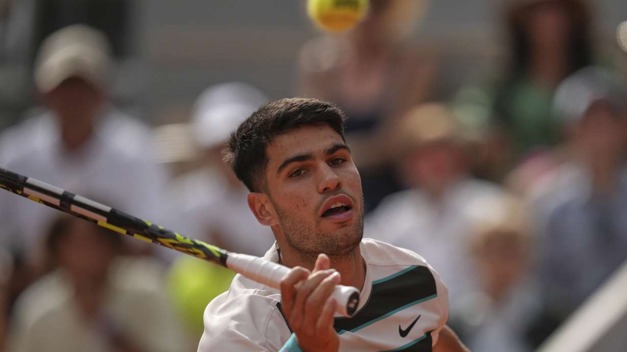 Spain's Carlos Alcaraz returns the ball to Ben Shelton of the U.S. during their fourth round match of the French Tennis Open, at the Roland-Garros stadium, in Paris, Sunday, June 1 2025.