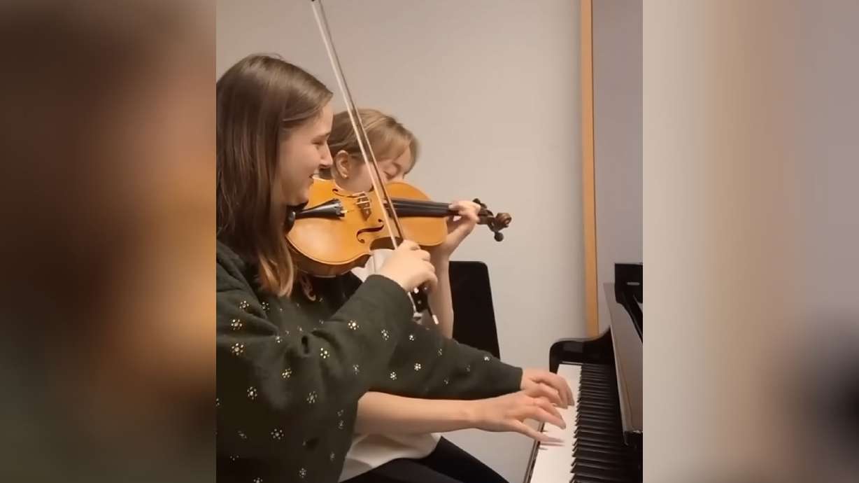 Two musicians play half of the other's instrument and somehow it works.