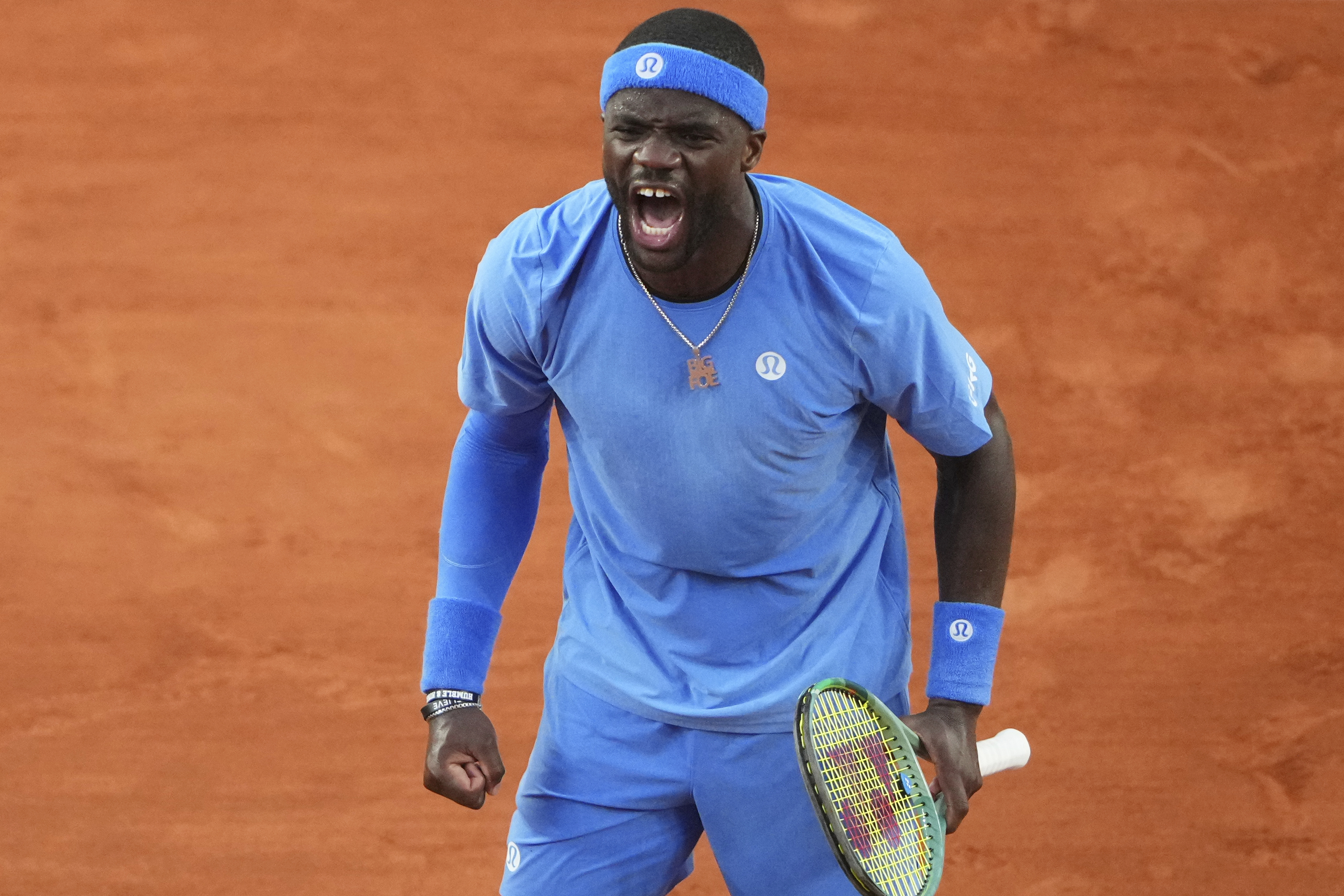 Frances Tiafoe of the U.S. celebrates beating Germany's Daniel Altmaier during their fourth round match of the French Tennis Open, at the Roland-Garros stadium, in Paris, Sunday, June 1 2025. 