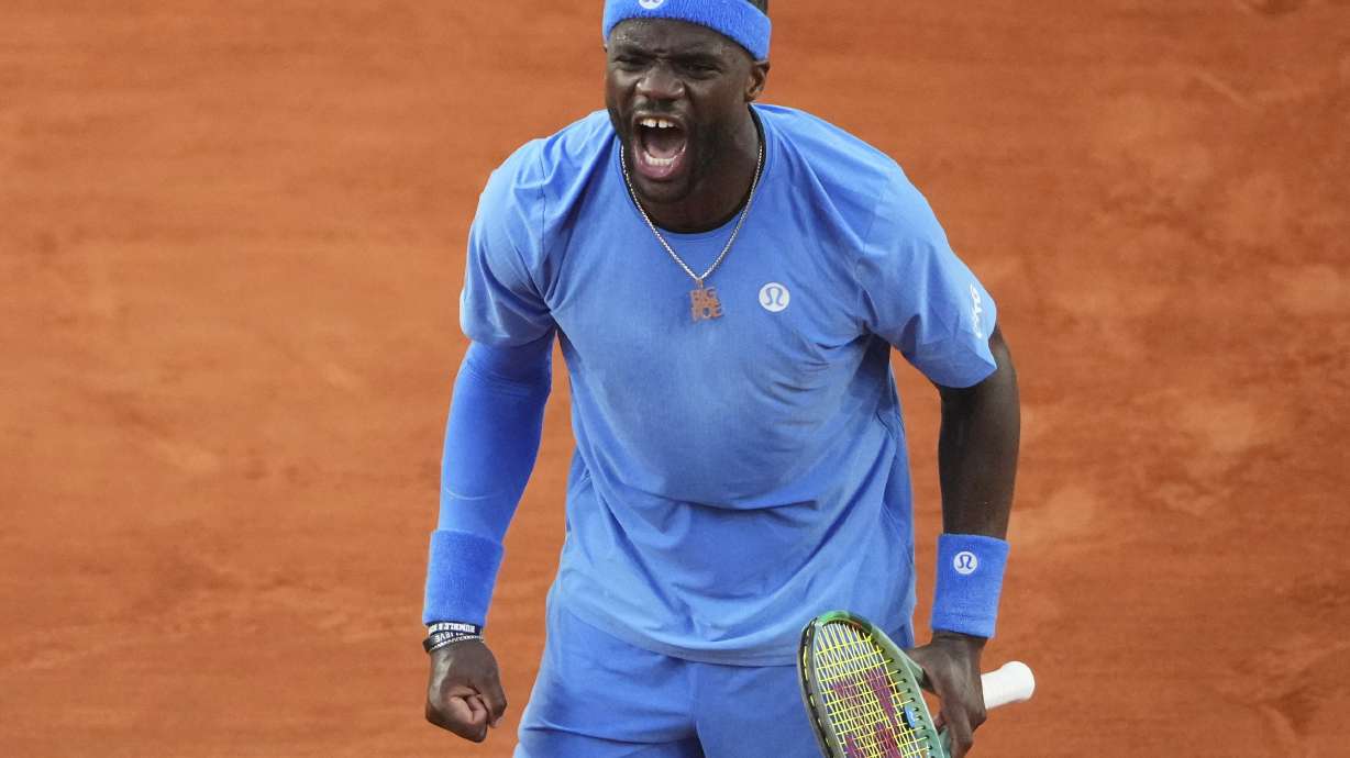 Frances Tiafoe of the U.S. celebrates beating Germany's Daniel Altmaier during their fourth round match of the French Tennis Open, at the Roland-Garros stadium, in Paris, Sunday, June 1 2025.