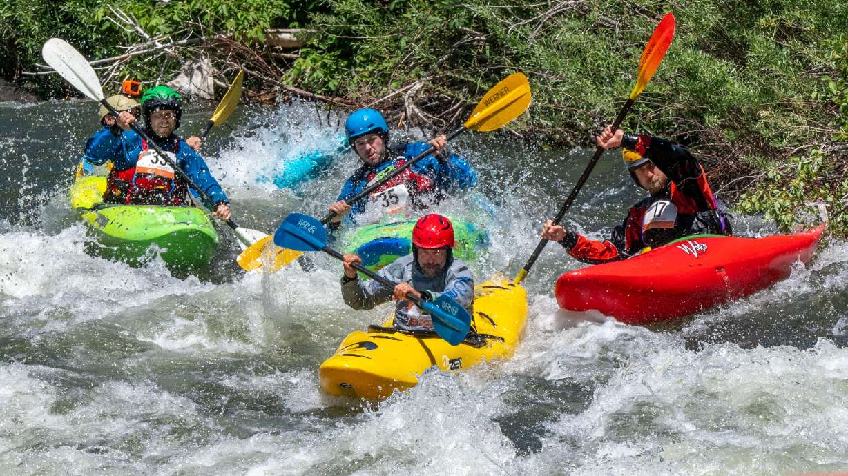 Competitors compete in the Provo River Race, a whitewater kayak competition in Provo Canyon on Saturday.