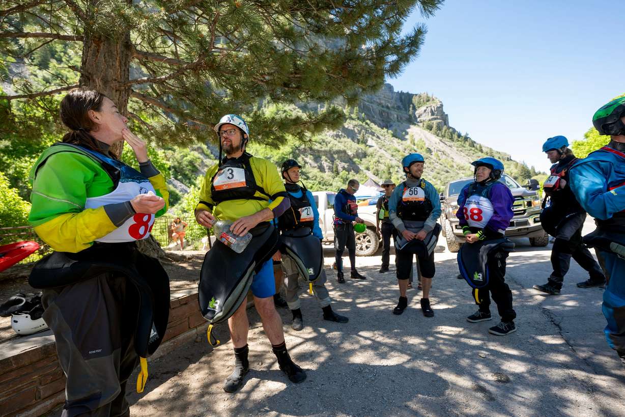 Competitors talk prior to competing in the Provo River Race, a whitewater kayak competition in Provo Canyon on Saturday.