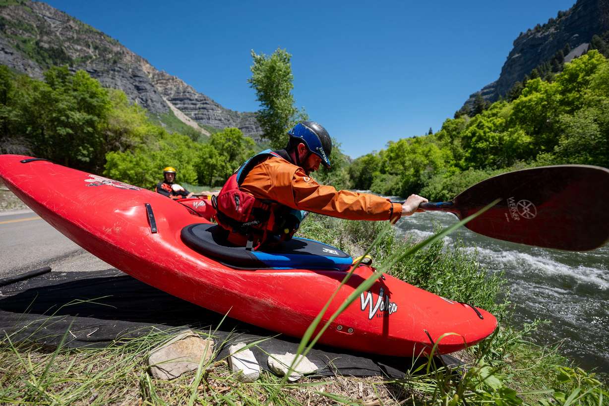 Brendon Mackey begins a run as he and other competitors compete in the Provo River Race, a whitewater kayak competition in Provo Canyon on Saturday.