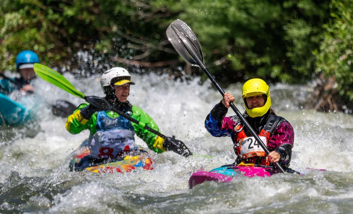Lenore Perot and other competitors compete in the Provo River Race, a whitewater kayak competition in Provo Canyon on Saturday.