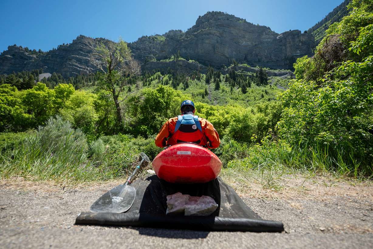 Brendon Mackey prepares to begin a run as he and other competitors compete in the Provo River Race, a whitewater kayak competition in Provo Canyon on Saturday.