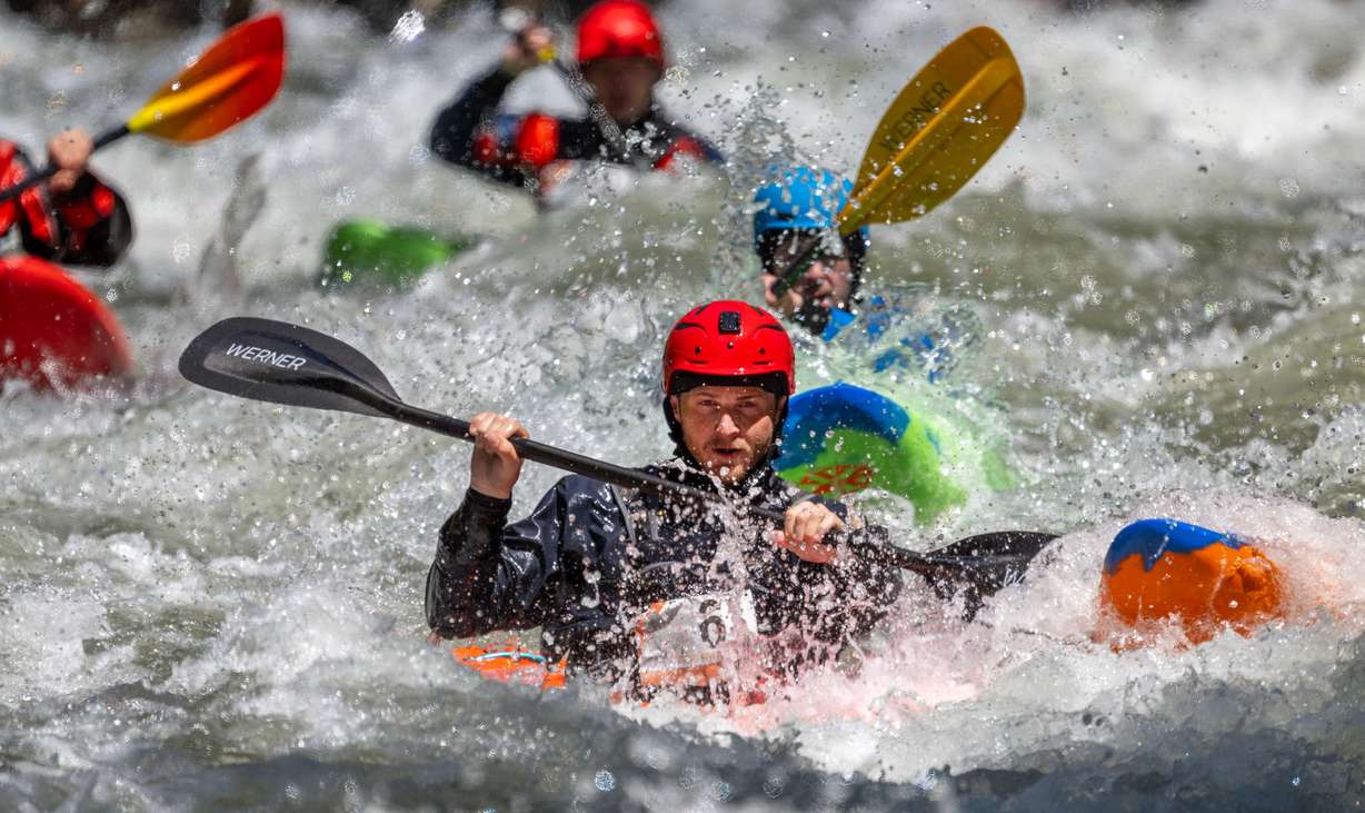 Hank Evette and other competitors compete in the Provo River Race, a whitewater kayak competition in Provo Canyon on Saturday.