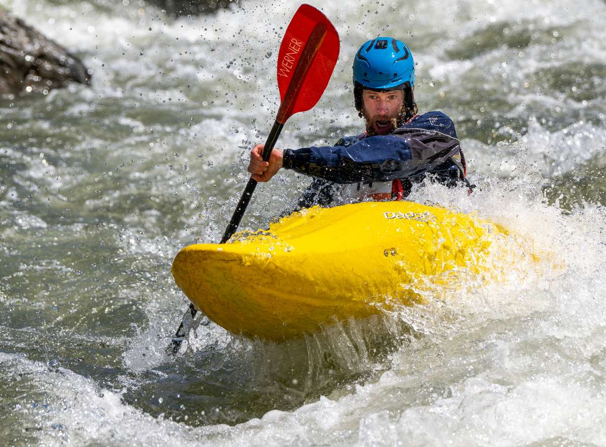Dan Varick looks downriver as he and other competitors compete in the Provo River Race, a whitewater kayak competition in Provo Canyon on Saturday.