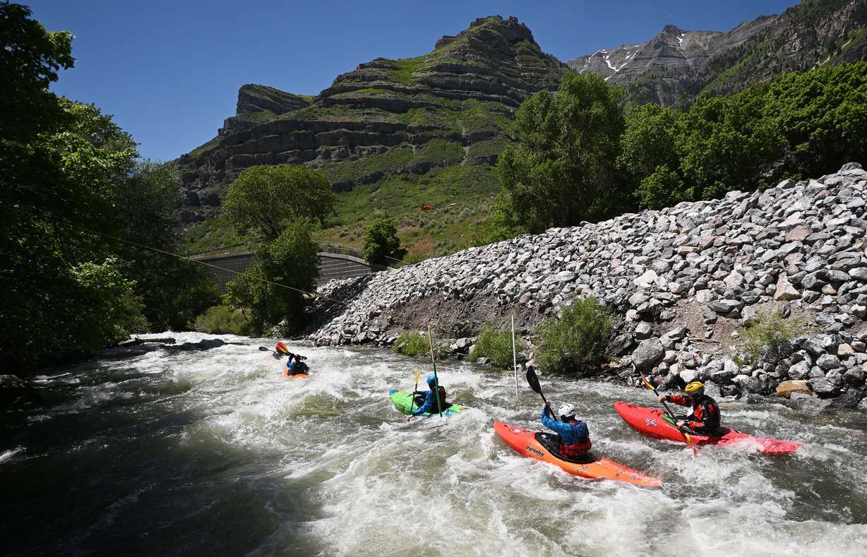 Competitors compete in the Provo River Race, a whitewater kayak competition in Provo Canyon on Saturday.
