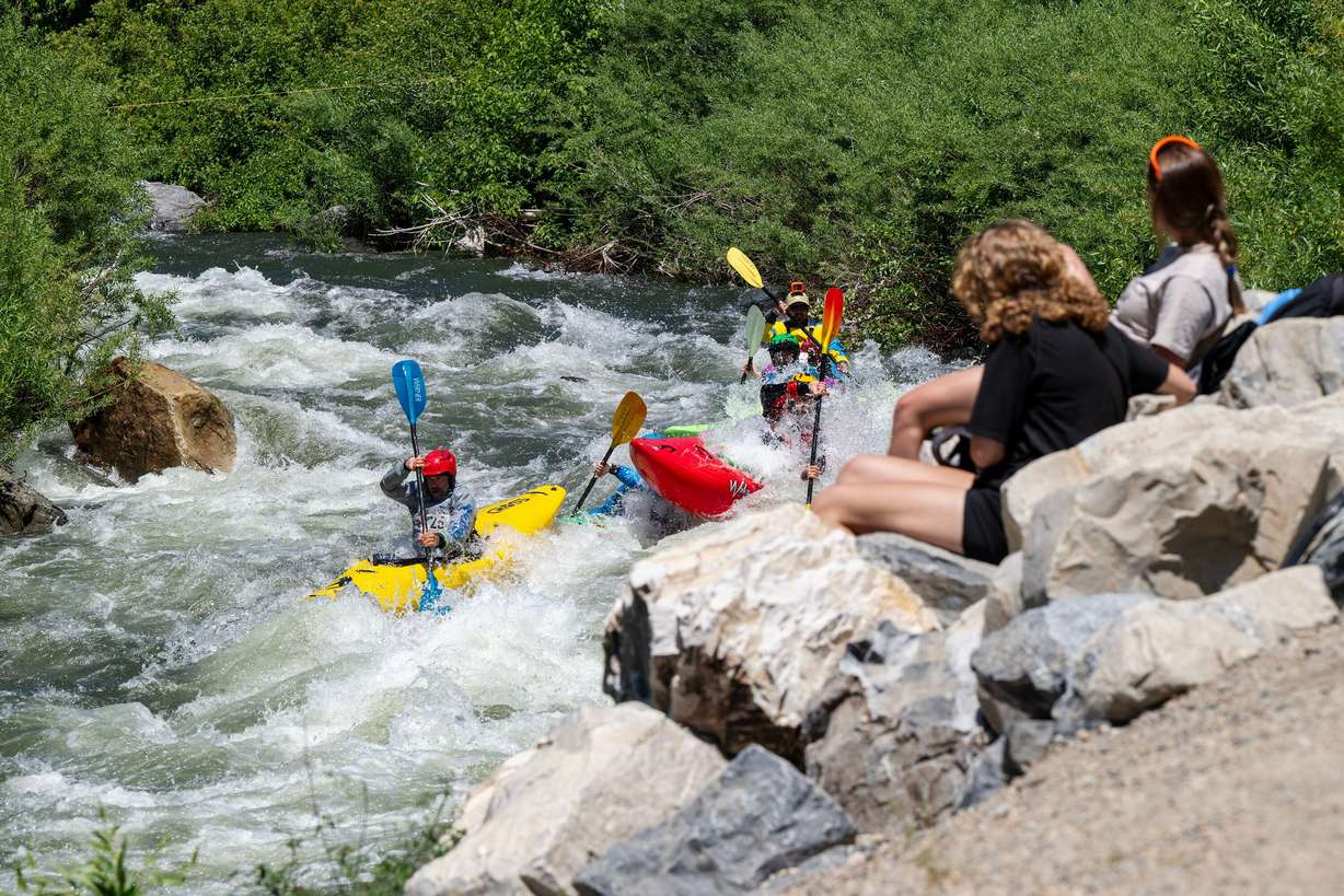 Onlookers watch as competitors compete in the Provo River Race, a whitewater kayak competition in Provo Canyon on Saturday.