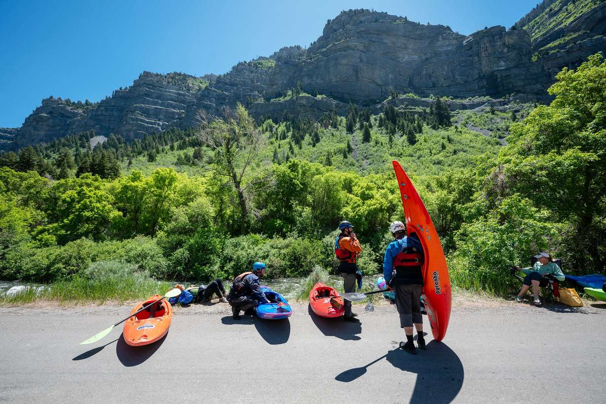 Competitors get ready to compete in the Provo River Race, a whitewater kayak competition in Provo Canyon on Saturday.
