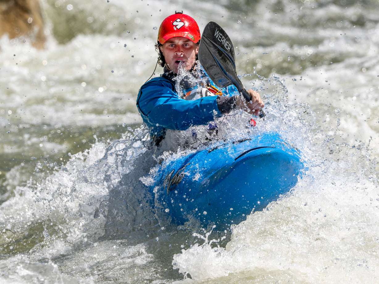 Parker Phillips eyes a line as he and other competitors compete in the Provo River Race, a whitewater kayak competition in Provo Canyon on Saturday.
