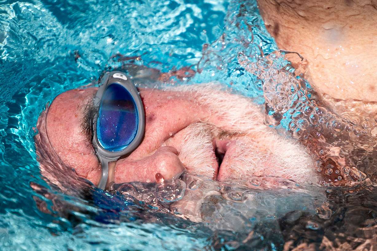 Joe Horton, of Murray, comes up for air as he swims laps at the Sports Mall in Salt Lake City on May 28.