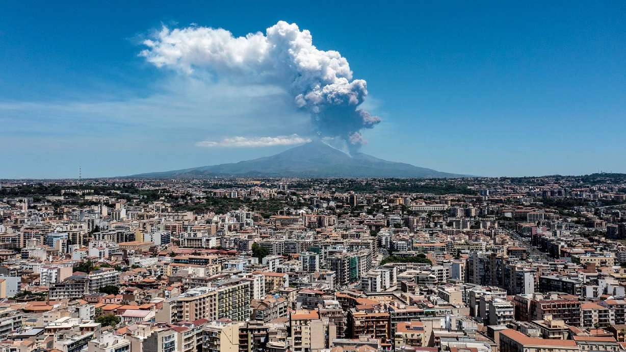 Italy's Mount Etna erupts, with a volcanic plume rising from the southeast crater on Monday.